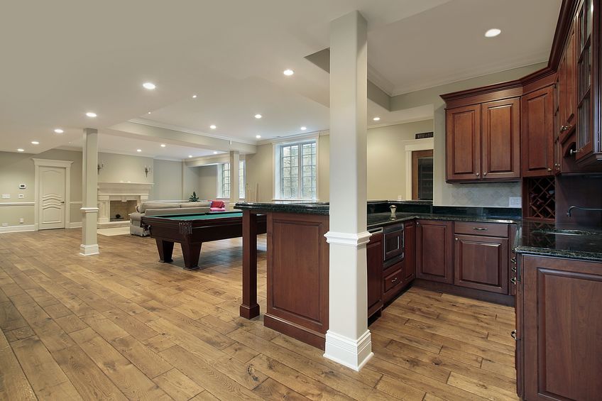 beautiful finished basement with bar and fireplace